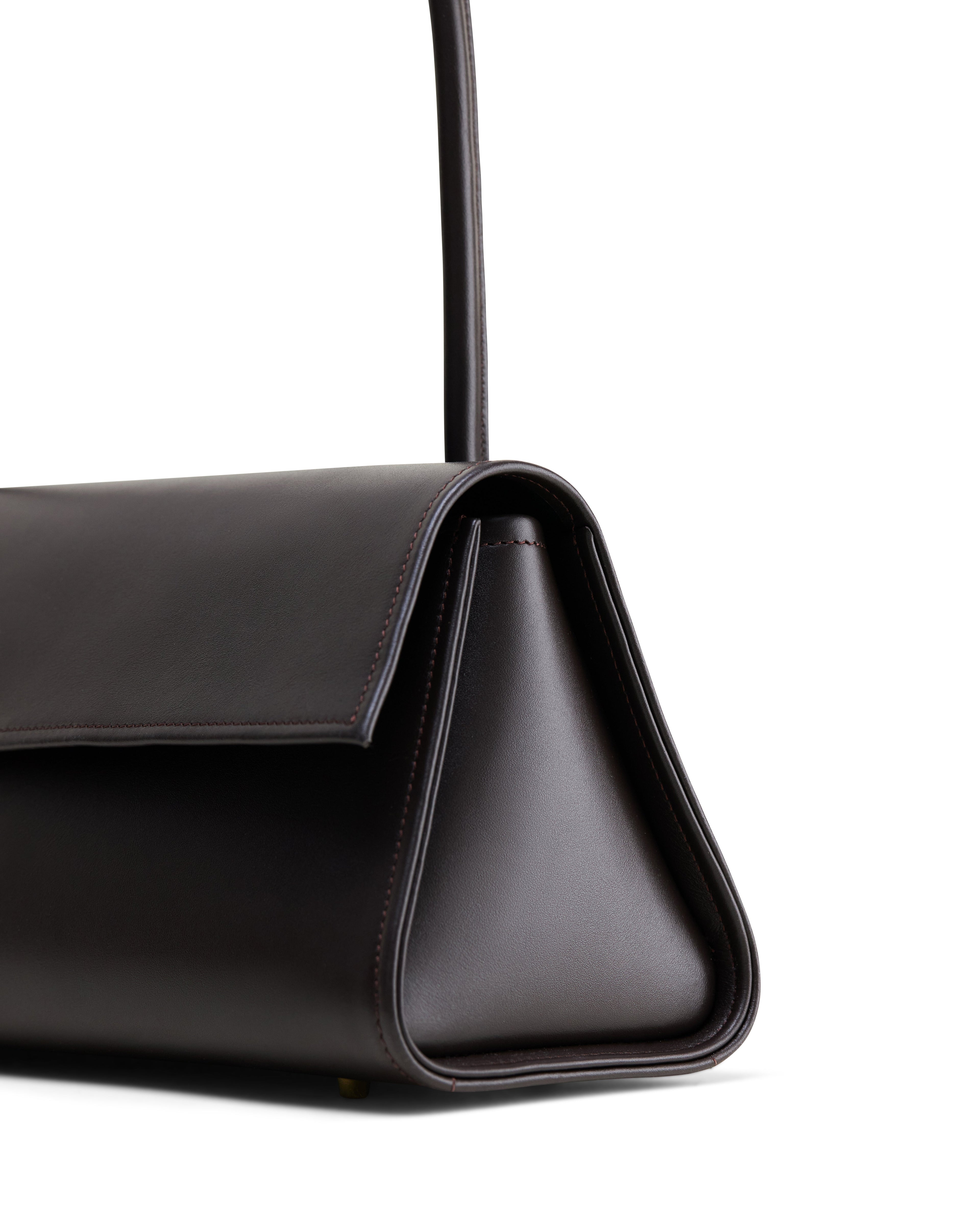 Black high-end fashion leather bag by Poelle Atelier with sleek triangular side and top handle