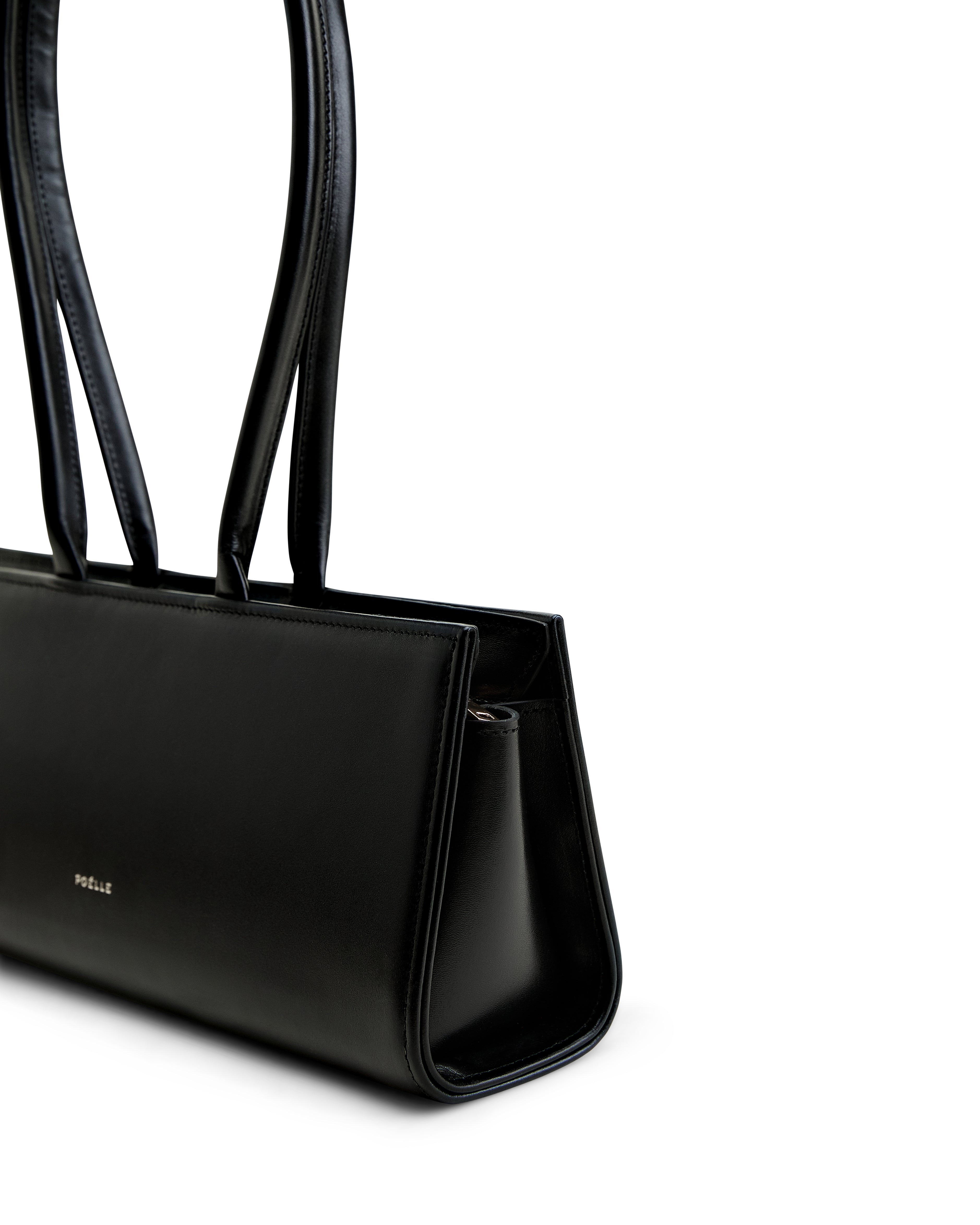 Luxury black leather handbag by Poelle Atelier with sleek design and double shoulder straps