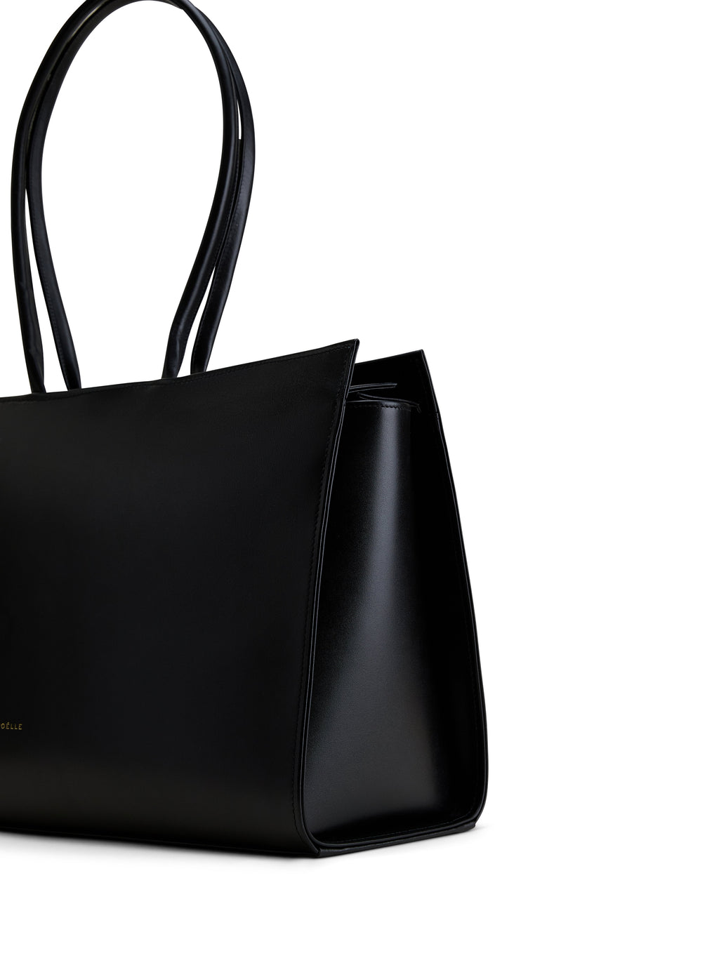 Luxury black leather tote from Poelle Atelier with sleek design and long handles